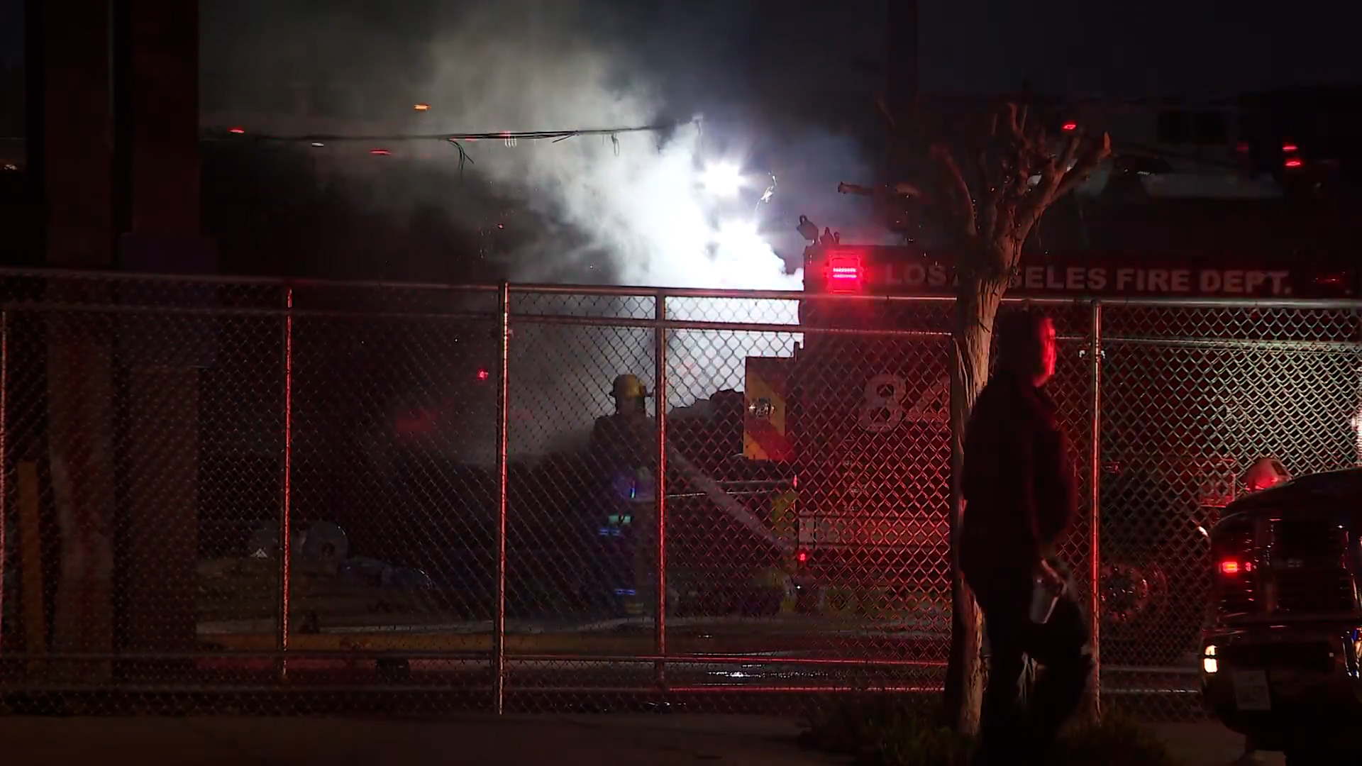 A Los Angeles firefighter was hurt when a driver ran over a hose in Tarzana on March 13, 2023. (KTLA)