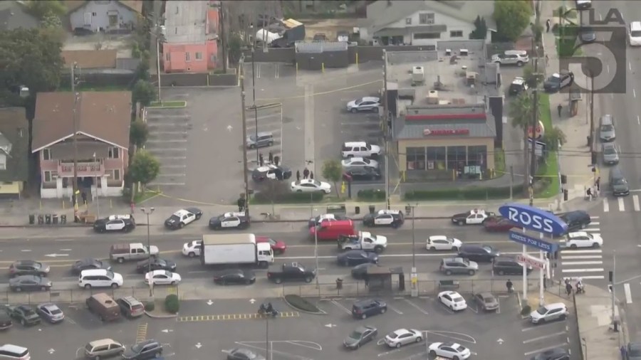 Police investigating a shooting outside of a Burger King in South Los Angeles on March 17, 2023. (KTLA)