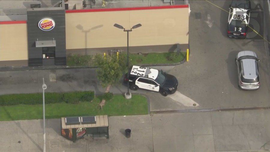 Police investigating a shooting outside of a Burger King in South Los Angeles on March 17, 2023. (KTLA)