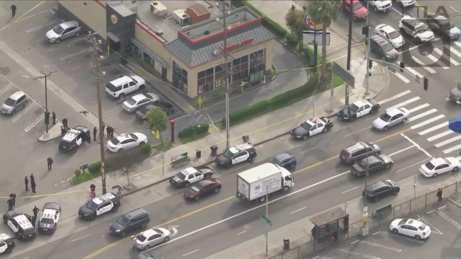 Police investigating a shooting outside of a Burger King in South Los Angeles on March 17, 2023. (KTLA)