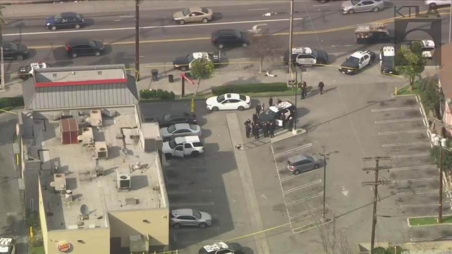 Police investigating a shooting outside of a Burger King in South Los Angeles on March 17, 2023. (KTLA)