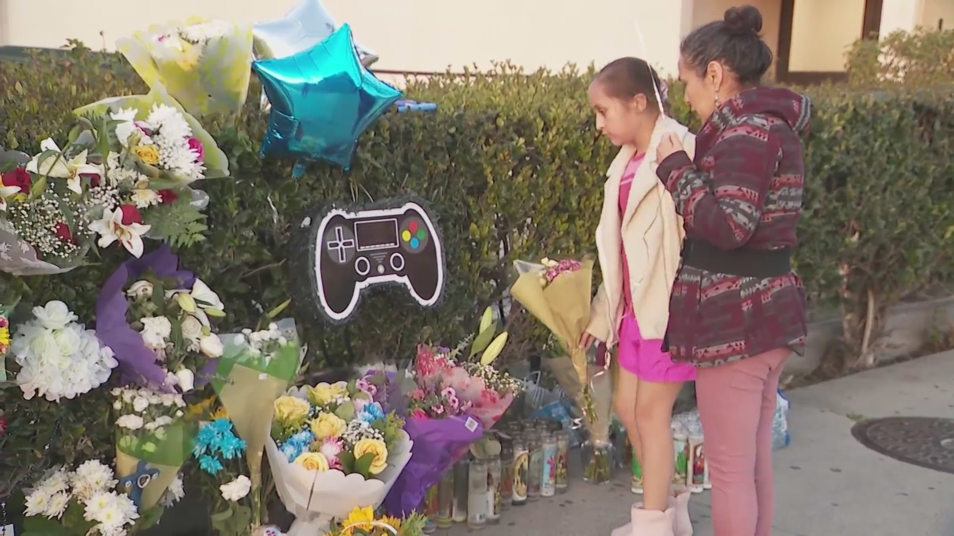 Loved ones mourn Xavier Chavarin in an El Sereno memorial on March 7, 2023. (KTLA)