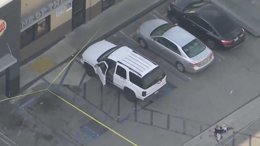 The victim's vehicle parked outside of a Burger King in South Los Angeles after a shooting on March 17, 2023. (KTLA)