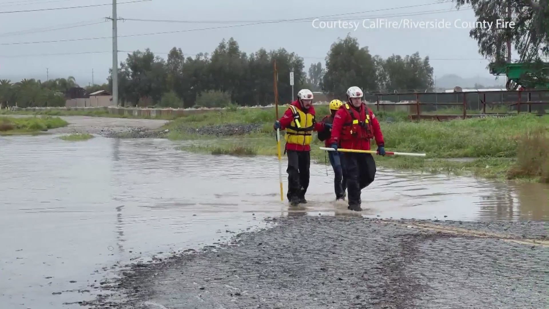 Driver rescued from flooded road in the Inland Empire. (CalFire/Riverside County Fire.)