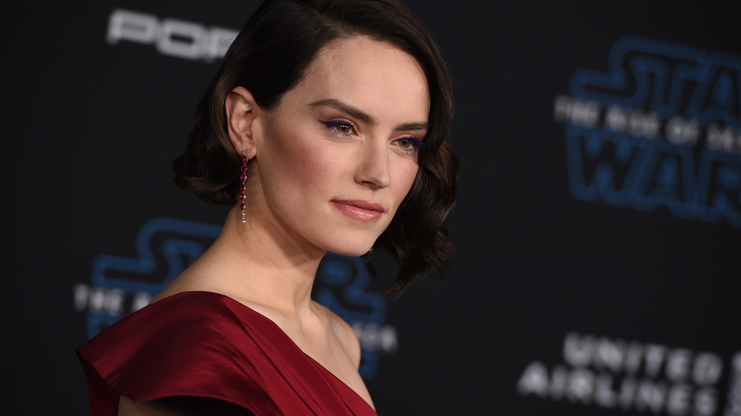 FILE - Daisy Ridley arrives at the world premiere of "Star Wars: The Rise of Skywalker" on Dec. 16, 2019, in Los Angeles. Lucasfilm announced three new live-action films in the "Star Wars" franchise which includes the return of Ridley as Rey. (Jordan Strauss/Invision/AP, File)