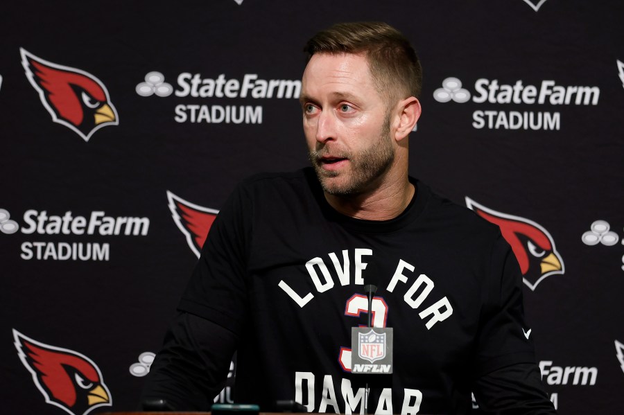 FILE - Arizona Cardinals head coach Kliff Kingsbury wears a shirt in support of Buffalo Bills' Damar Hamlin as he speaks at a news conference after the team's NFL football game against the San Francisco 49ers in Santa Clara, Calif., Sunday, Jan. 8, 2023. Kingsbury is joining Lincoln Riley's coaching staff at Southern California as a senior offensive analyst. USC announced the addition Tuesday, April 11, 2023. (AP Photo/Jed Jacobsohn, File)