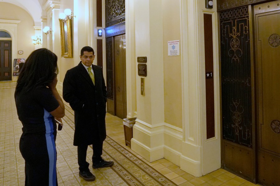 Democratic Assemblyman Miguel Santiago, waits for an elevator in the nearly empty state Capitol after a "credible threat" forced California lawmakers out of the building In Sacramento, Calif., Thursday April 13, 2023. State Senate officials say they were notified about the threat by the California Highway Patrol, which declined to comment further. (Photo/Rich Pedroncelli)