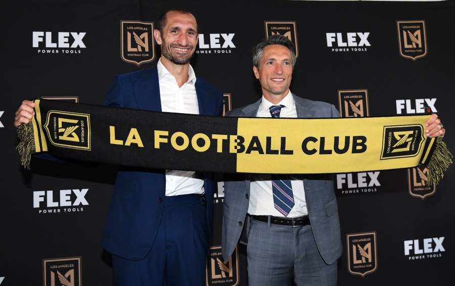 Defender Giorgio Chiellini (L) poses with LAFC Co-President and General Manager John Thorrington after Chiellini was introduced during a news conference at Banc of California Stadium on June 29, 2022 in Los Angeles. (Kevork Djansezian/Getty Images)