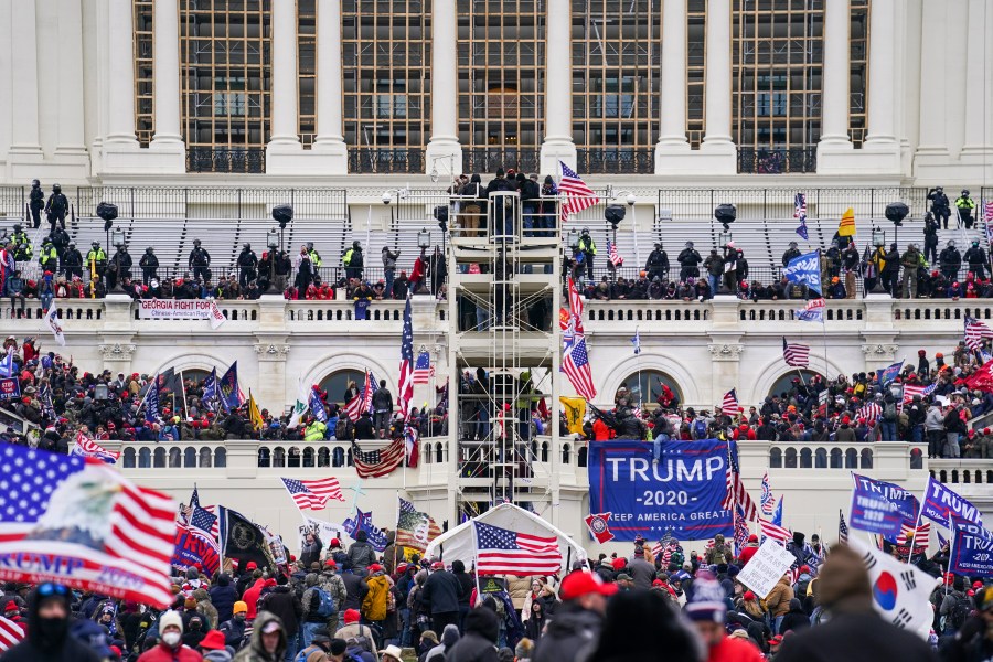 Insurrectionists loyal to President Donald Trump breach the U.S. Capitol in Washington, on Jan. 6, 2021. (AP Photo/John Minchillo)