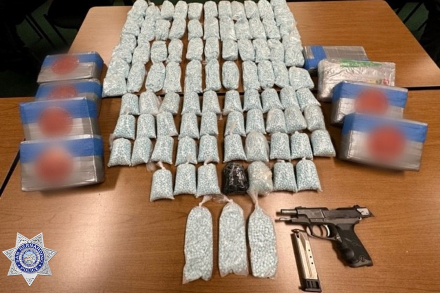 Police find 90,000 fentanyl pills, eight kilos of powdered fentanyl and a stolen firearm in a massive drug bust. (San Bernardino Police Department.)