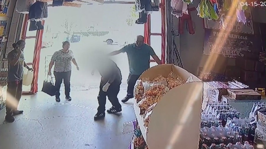 Security video shows a victim entering a nearby shop for help after he was shot in a Northridge strip mall on April 15, 2023. (Northridge Ice Cream)