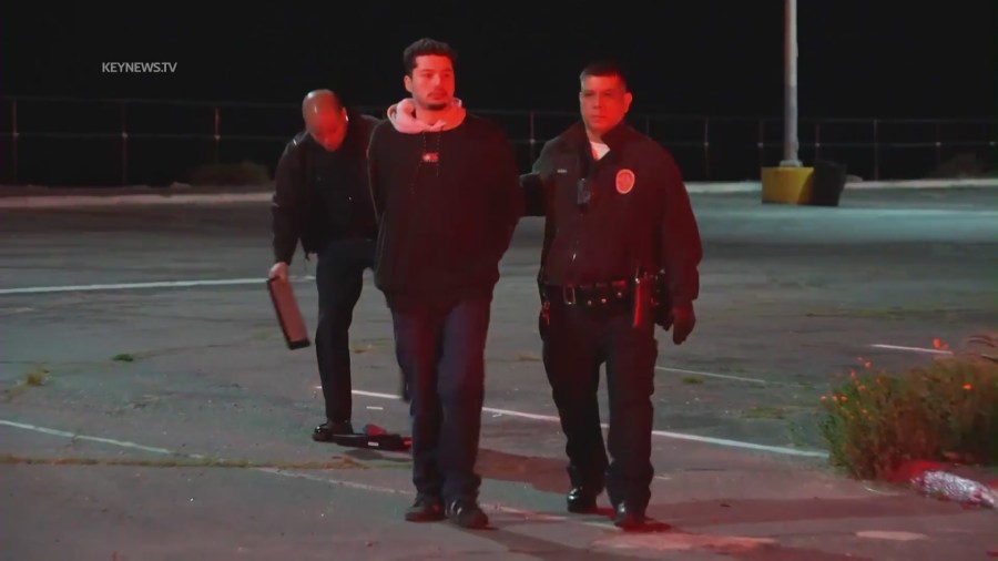 The 21-year-old suspected DUI driver being taken into custody following a deadly crash in Pacific Palisades on April 8, 2023. (KeyNews.TV)