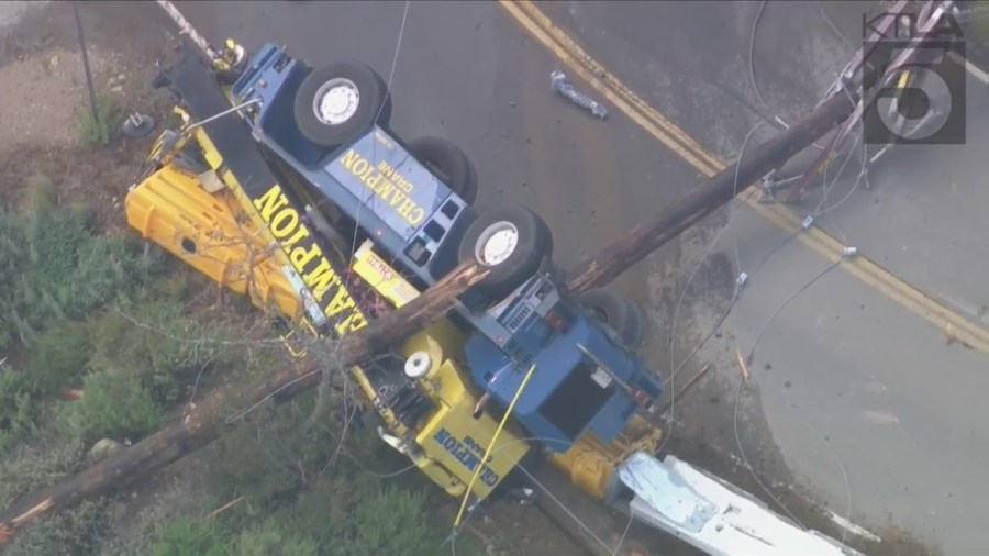 The driver of a crane vehicle was killed after crashing into a power pole in Malibu on April 5, 2023. (KTLA)