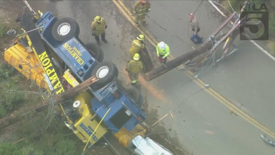 The driver of a crane vehicle was killed after crashing into a power pole in Malibu on April 5, 2023. (KTLA)