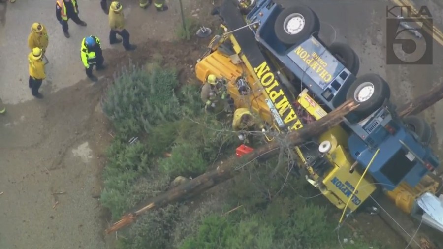 The driver of a crane vehicle was killed after crashing into a power pole in Malibu on April 5, 2023. (KTLA)