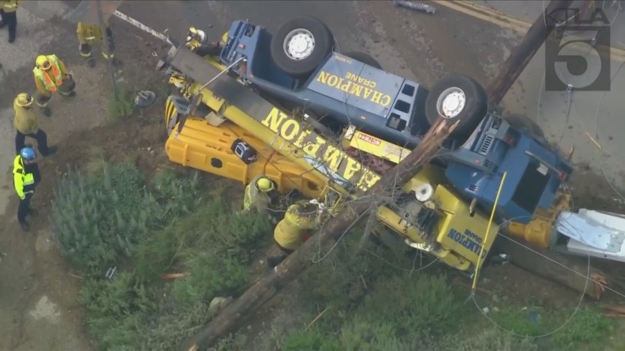 The driver of a crane vehicle was killed after crashing into a power pole in Malibu on April 5, 2023. (KTLA)