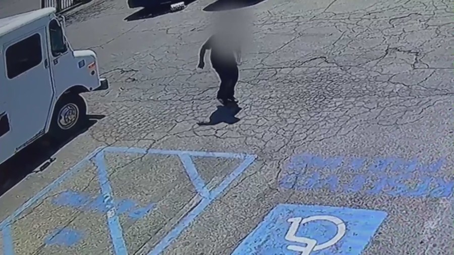 Security video shows a victim entering a nearby shop for help after he was shot in a Northridge strip mall on April 15, 2023. (Northridge Ice Cream)