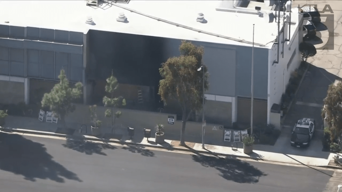 A worker repairs a South Los Angeles LAPD station after it suffers fire damage on April 7, 2023. (KTLA)