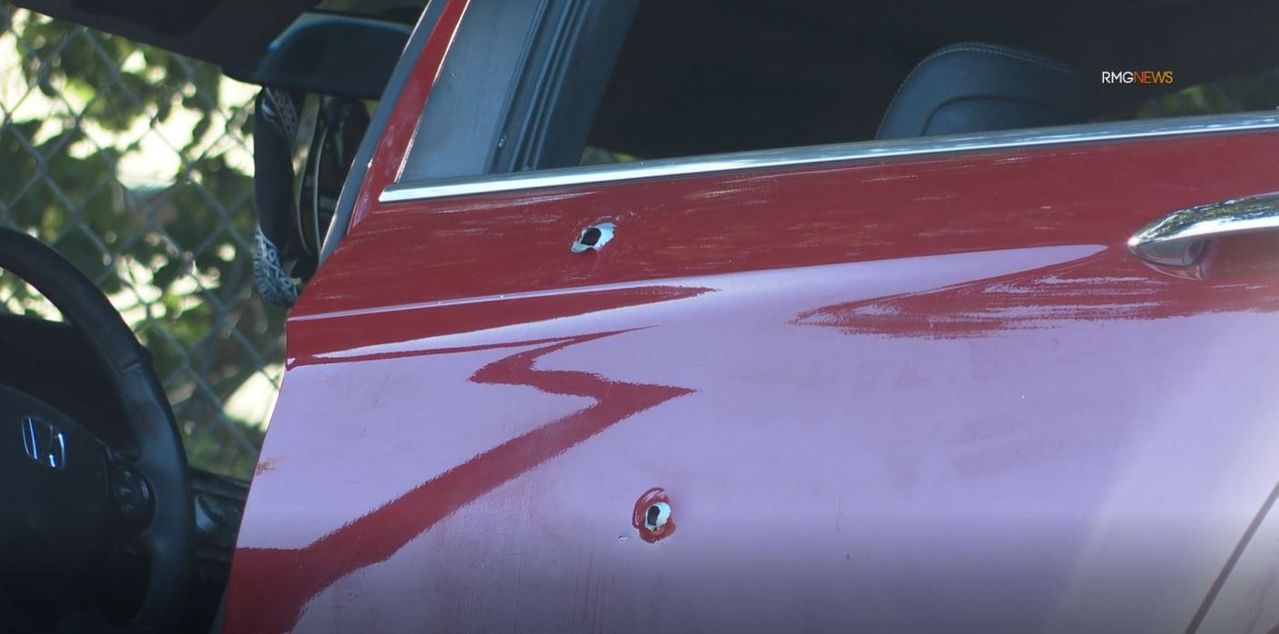 The suspect’s bullet-riddled car after a shooting left one person dead and three others critically injured in a West Hills shopping center on April 1, 2023. (RMG)