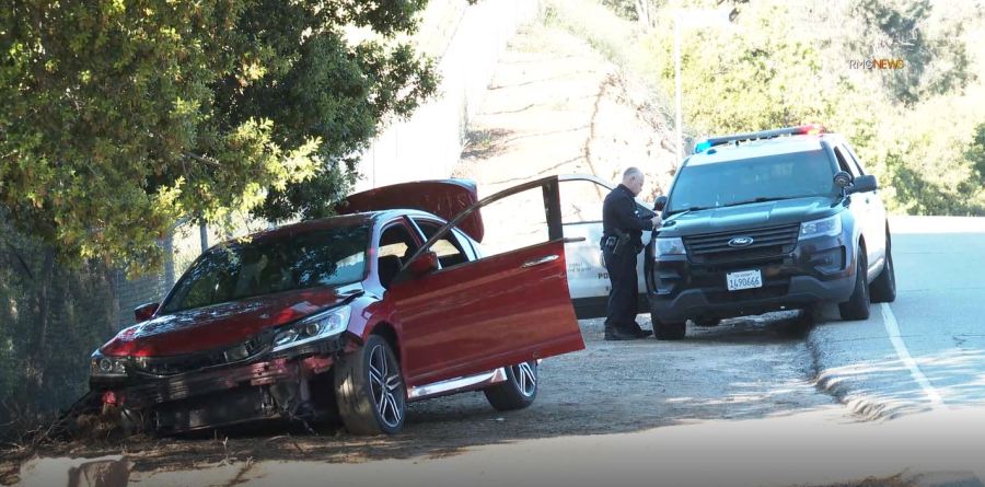 The suspect’s bullet-riddled car after a shooting left one person dead and three others critically injured in a West Hills shopping center on April 1, 2023. (RMG)