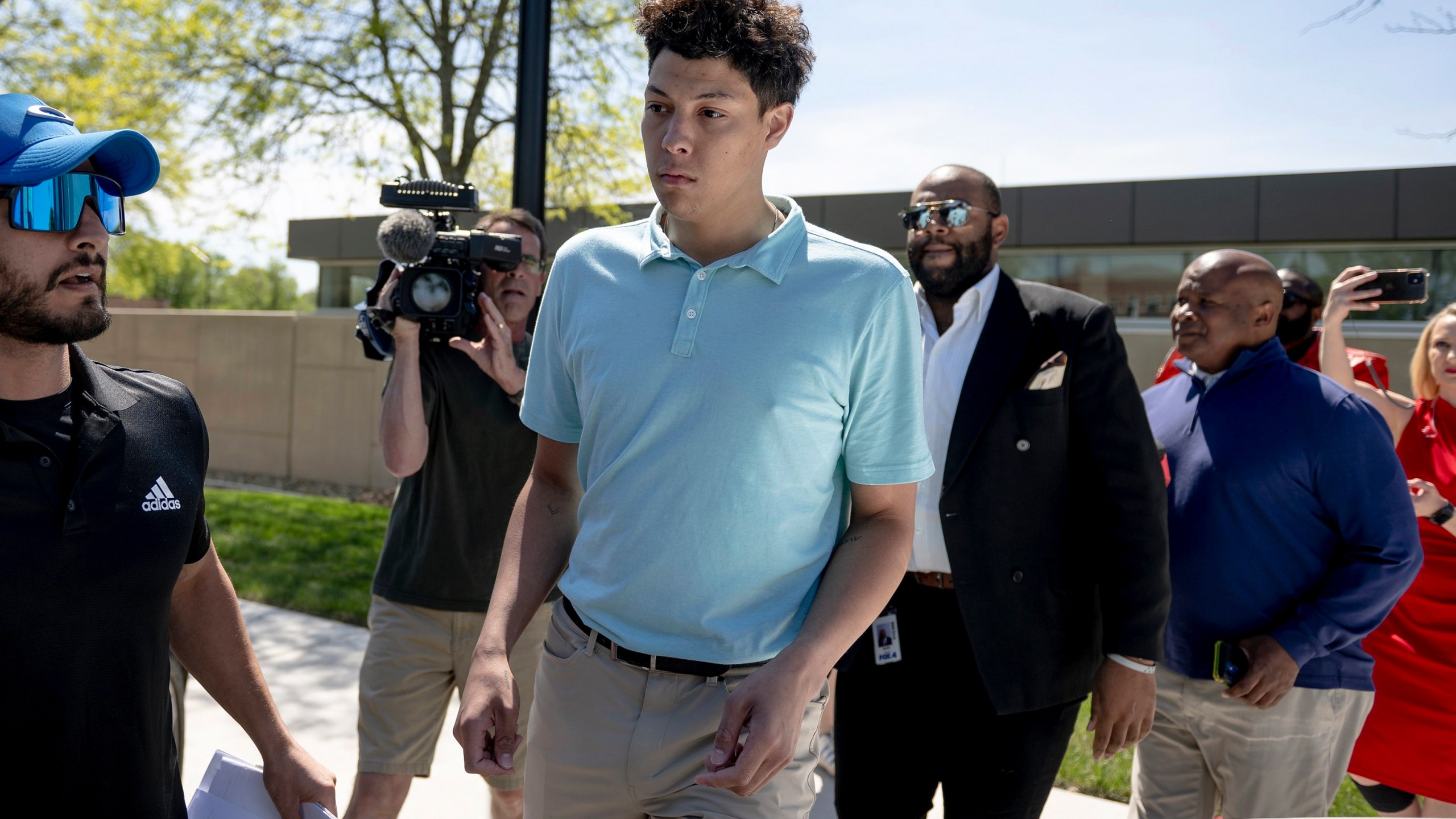 Jackson Mahomes, center, exits the Johnson County jail after being arraigned on three charges of sexual battery on Wednesday, May 3, 2023, in Olathe, Kan. (Nick Wagner/The Kansas City Star via AP)