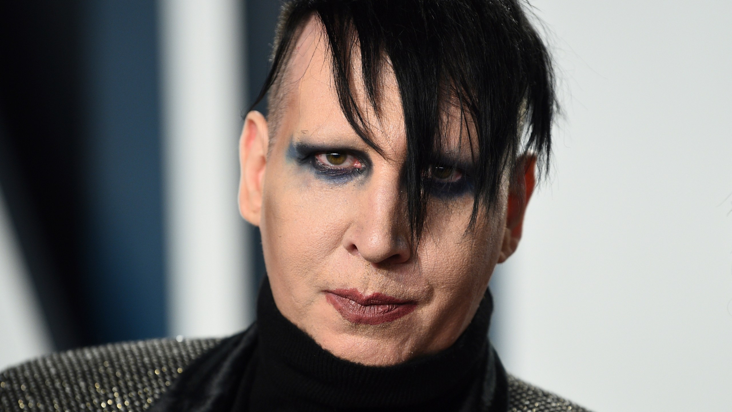 FILE - Marilyn Manson arrives at the Vanity Fair Oscar Party, Feb. 9, 2020, in Beverly Hills, Calif. On Tuesday, May 9, 2023, a California judge threw out key sections of Manson's lawsuit against his former fiancée, “Westworld” actor Evan Rachel Wood, claiming she fabricated public allegations that he sexually and physically abused her during their relationship and encouraged other women to do the same. (Photo by Evan Agostini/Invision/AP, File)