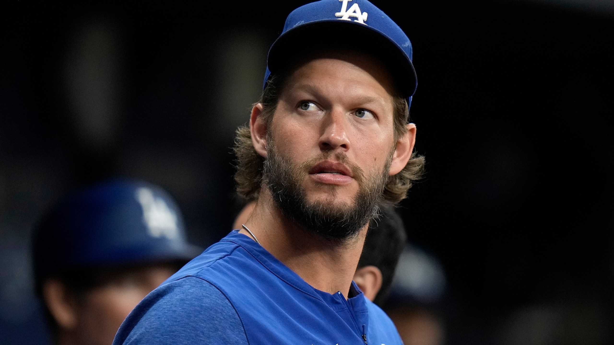 Los Angeles Dodgers starting pitcher Clayton Kershaw looks out of the dugout during the first inning of a baseball game against the Tampa Bay Rays Friday, May 26, 2023, in St. Petersburg, Fla. (AP Photo/Chris O'Meara)