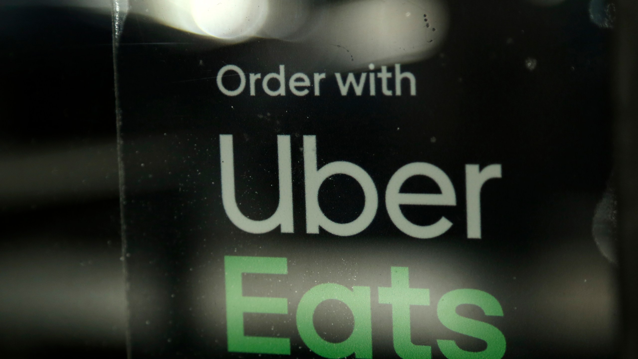 In this Nov. 6, 2019, file photo, a restaurant advertises Uber Eats in Miami. (Lynne Sladky/Associated Press)