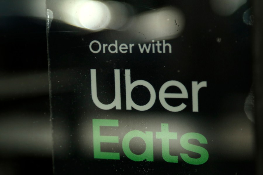 In this Nov. 6, 2019, file photo, a restaurant advertises Uber Eats in Miami. (Lynne Sladky/Associated Press)