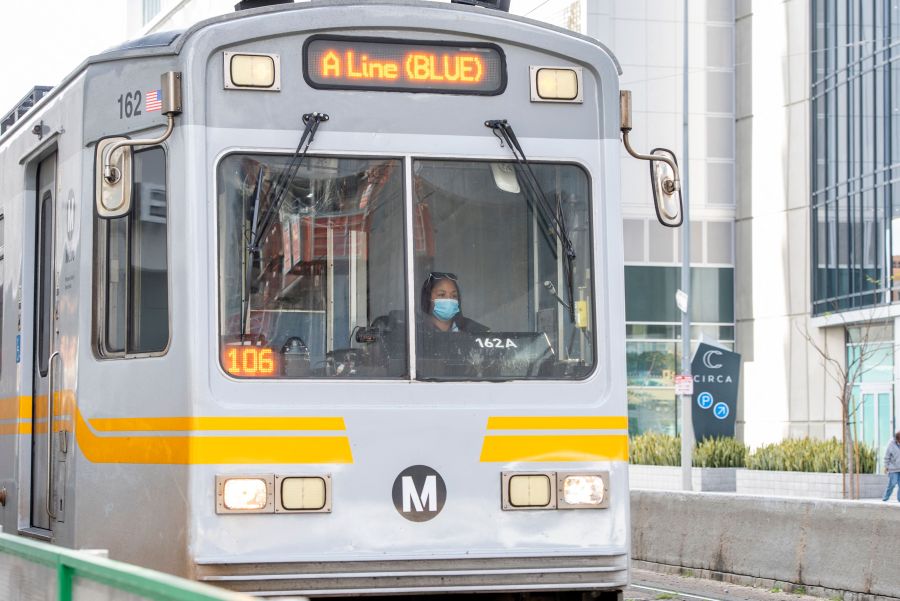 A woman drives a Metro line train in the downtown area on March 8, 2021 in Los Angeles, California. (Getty Images)