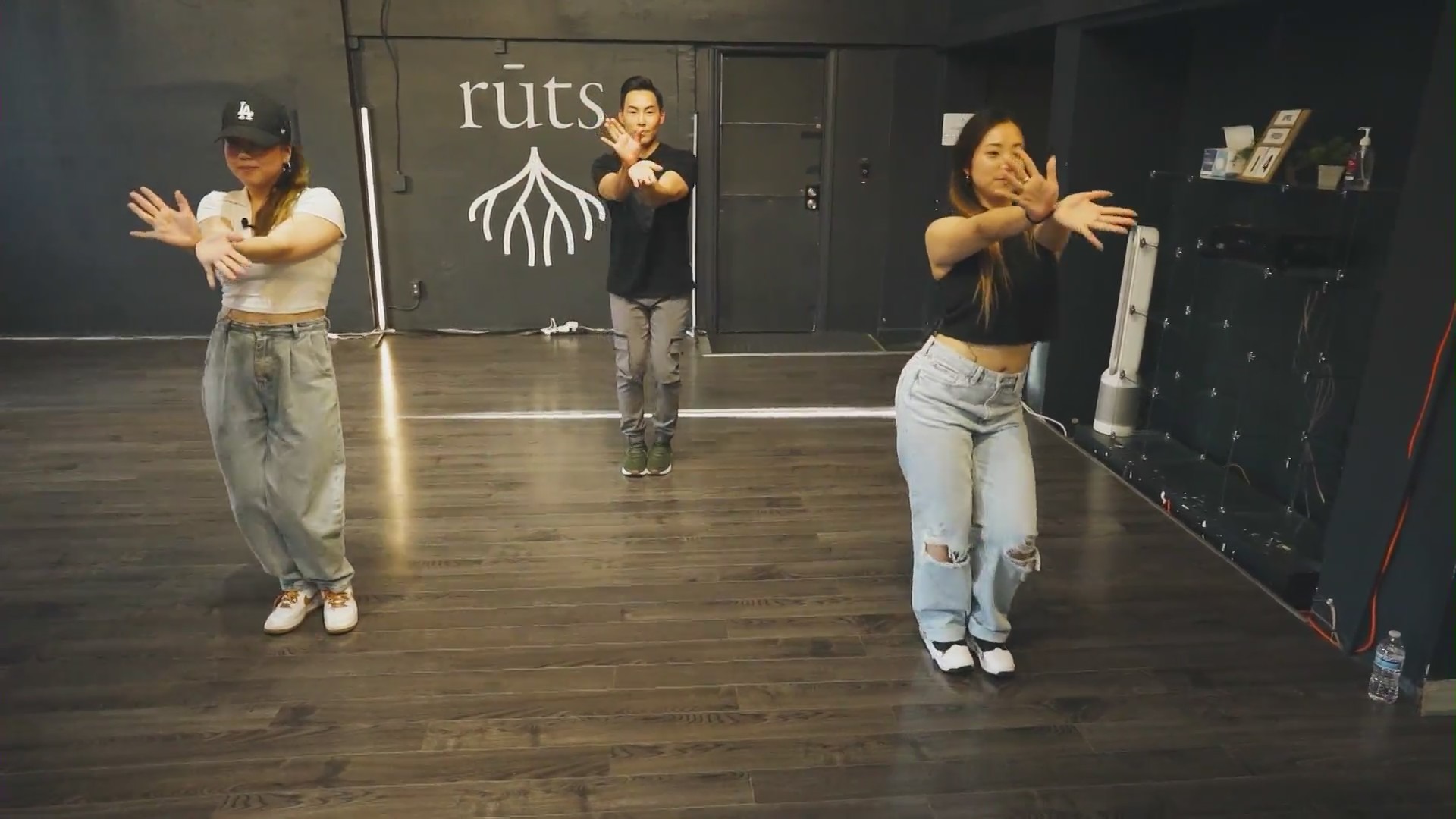 Diny and Eileen Kim teach KTLA's Gene Kang some of the hottest moves in K-pop at Rūts Dance Studio on May 30, 2023. (KTLA)