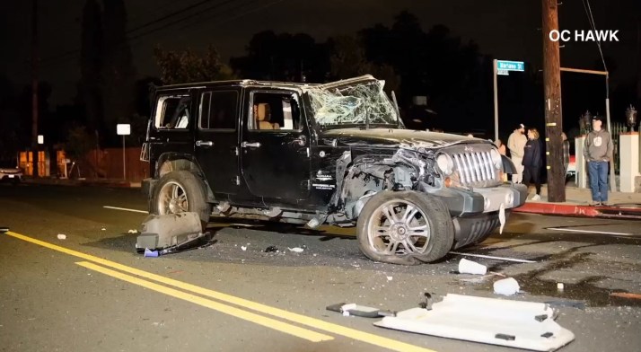 A Jeep was badly damaged after striking a parked truck in a fiery Woodland Hills crash on May 29, 2023. (OC Hawk)