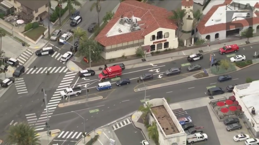 Police and ambulances respond to stabbings and an officer-involved shooting in Long Beach on May 30, 2023. (KTLA)