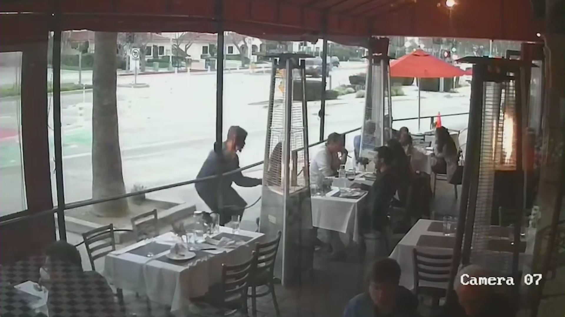 Video captured the moment a thief quickly snatches a woman's purse hanging on a dining chair at a Culver City restaurant on May 14, 2023. (Akasha)