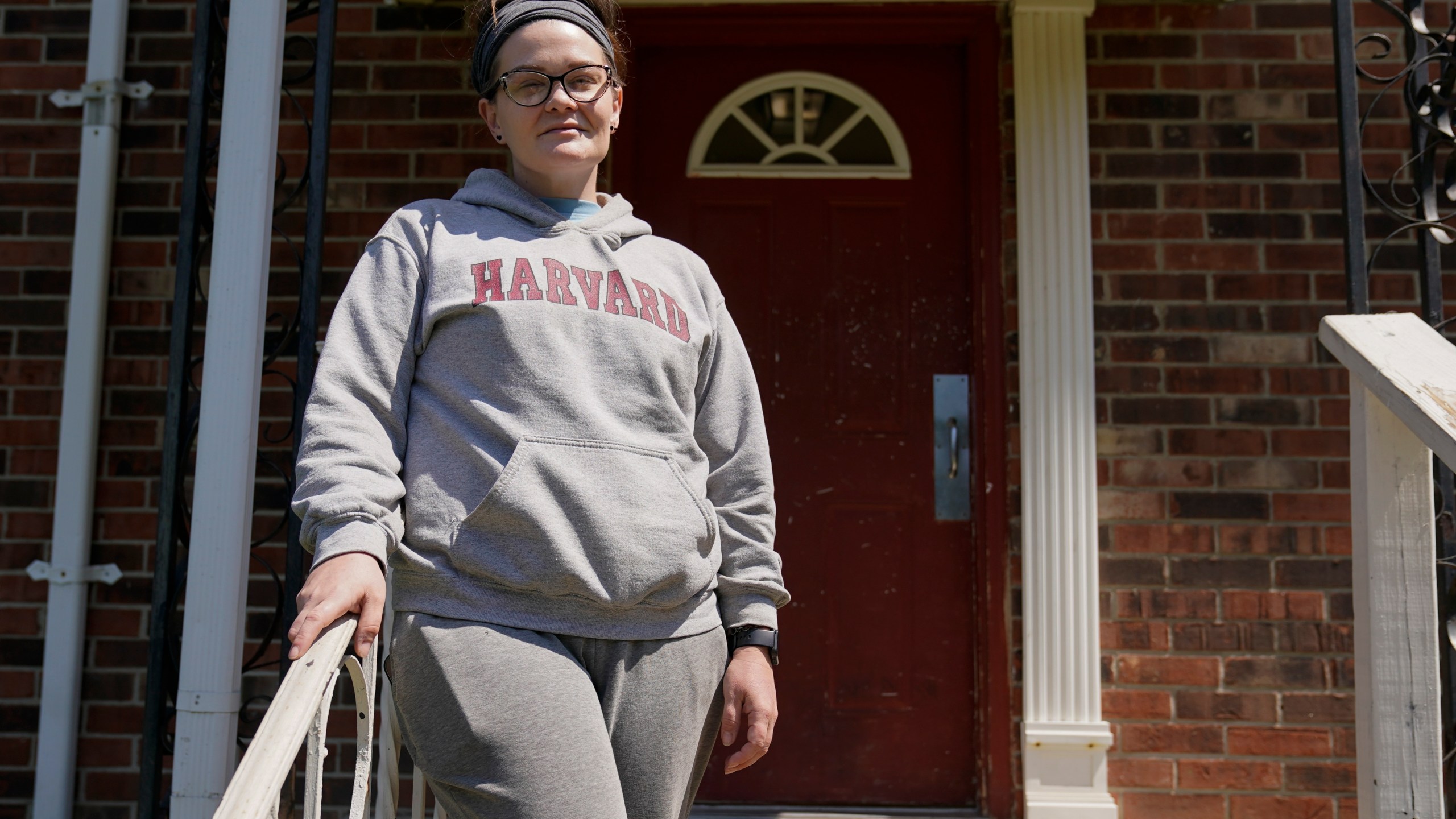 Samantha Richards stands outside of her apartment, Friday, June 9, 2023, in Bloomington, Ind. Richards has been on Medicaid her whole life and currently works two part-time jobs as a custodian. (AP Photo/Darron Cummings)