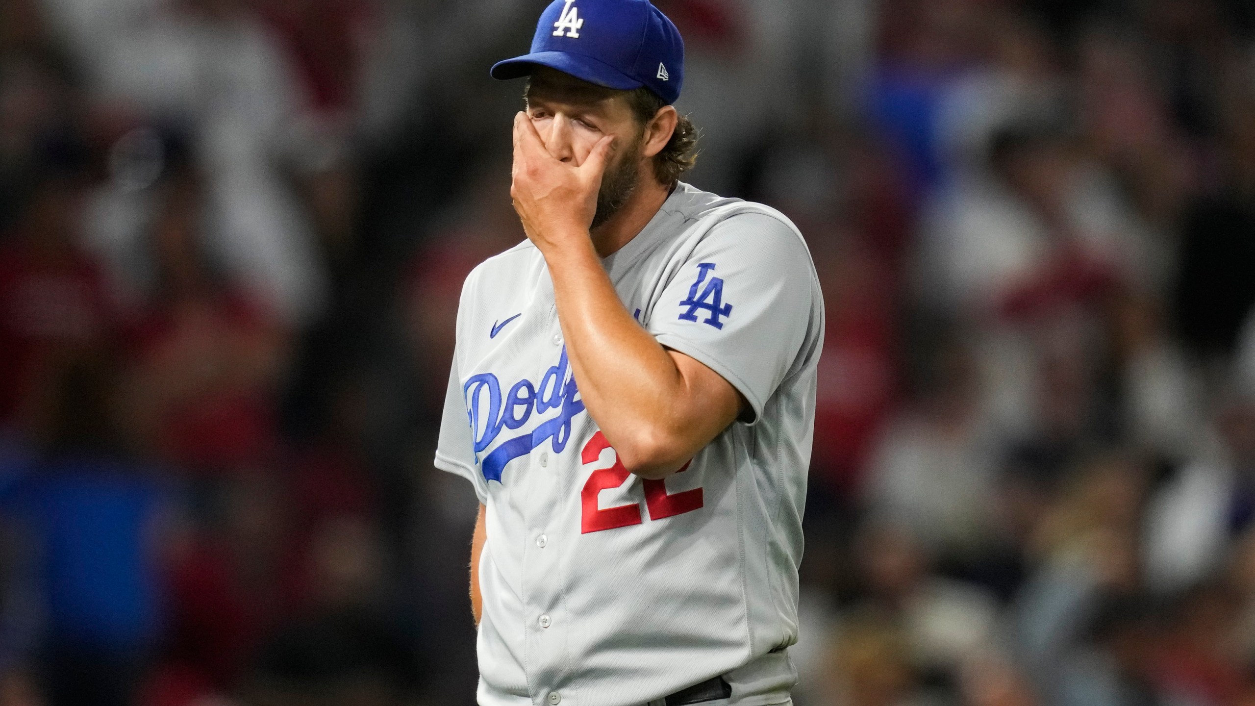 Los Angeles Dodgers starting pitcher Clayton Kershaw (22) reacts as he returns to the dugout after the seventh of a baseball game against the Los Angeles Angels in Anaheim, Calif., Tuesday, June 20, 2023. (AP Photo/Ashley Landis)