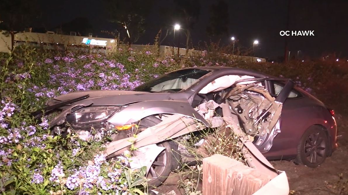 A violent crash into a freeway guardrail left a driver hospitalized in Anaheim on June 3, 2023. (OC Hawk)