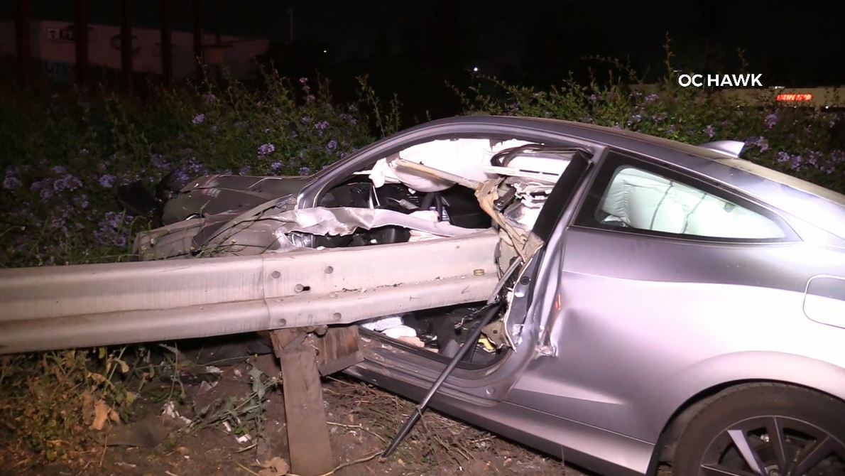 A violent crash into a freeway guardrail left a driver hospitalized in Anaheim on June 3, 2023. (OC Hawk)