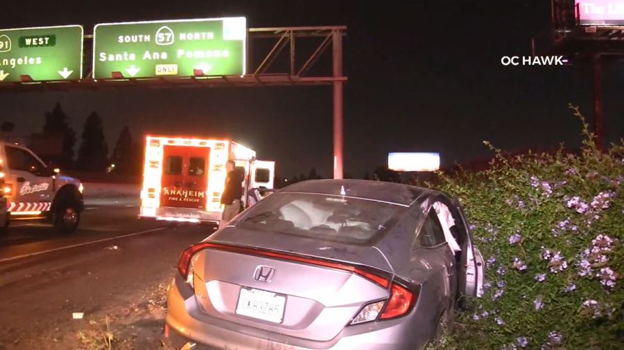 A violent crash into a freeway guardrail left a driver hospitalized in Anaheim on June 3, 2023. (OC Hawk)