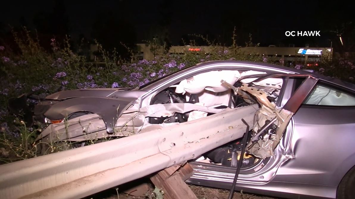 A violent crash into a freeway guardrail left a driver hospitalized in Anaheim on June 3, 2023. (OC Hawk)