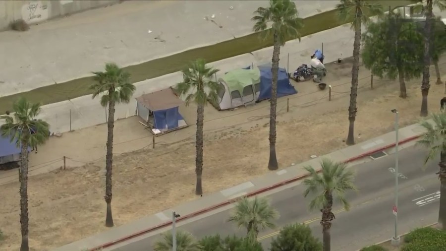 A homeless encampment near the Chatsworth Metrolink station, shown on June 1, 2023, has riled residents. (KTLA)