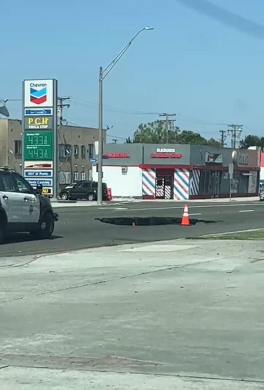 A sinkhole opened up in Long Beach along Pacific Coast Highway on June 3, 2023. (Citizen)