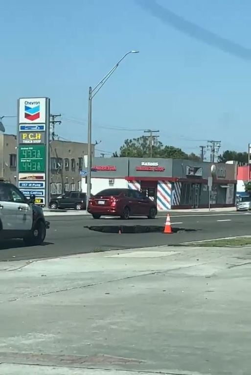 A sinkhole opened up in Long Beach along Pacific Coast Highway on June 3, 2023. (Citizen)