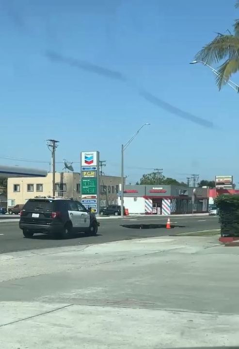 A sinkhole opened up in Long Beach along Pacific Coast Highway on June 3, 2023. (Citizen)