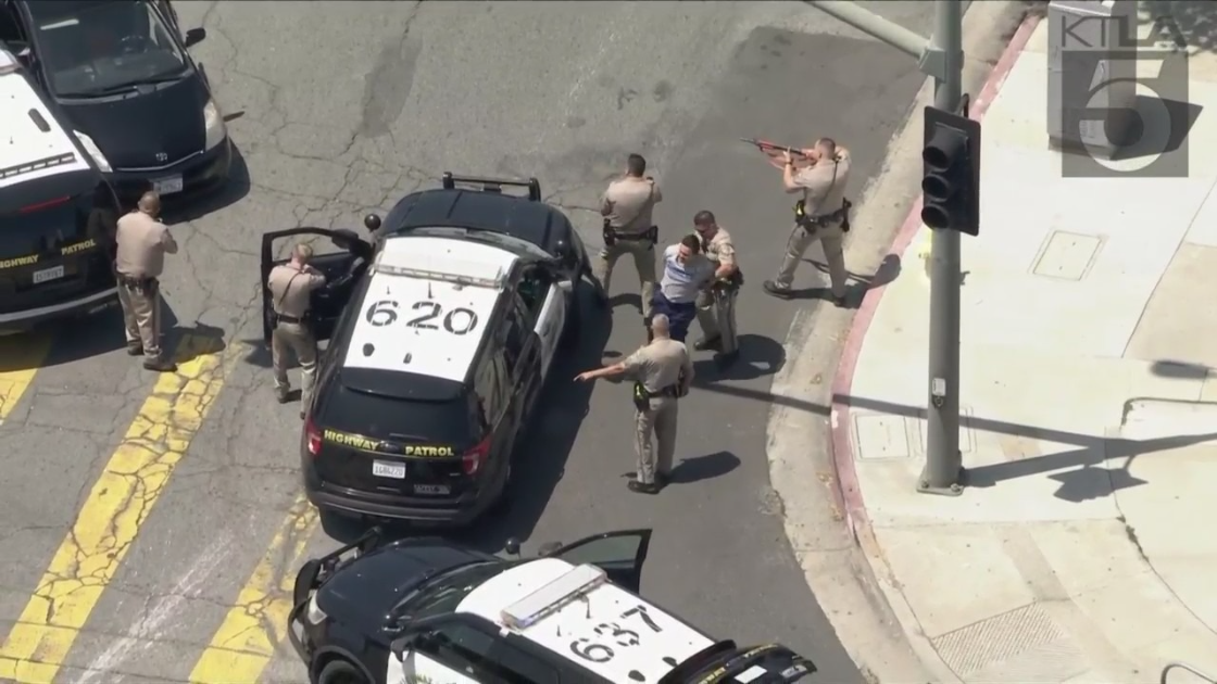 A driver in a vehicle associated with a catalytic converter theft in Camarillo is taken into custody after a chase in the San Fernando Valley on June 2, 2023. (KTLA)