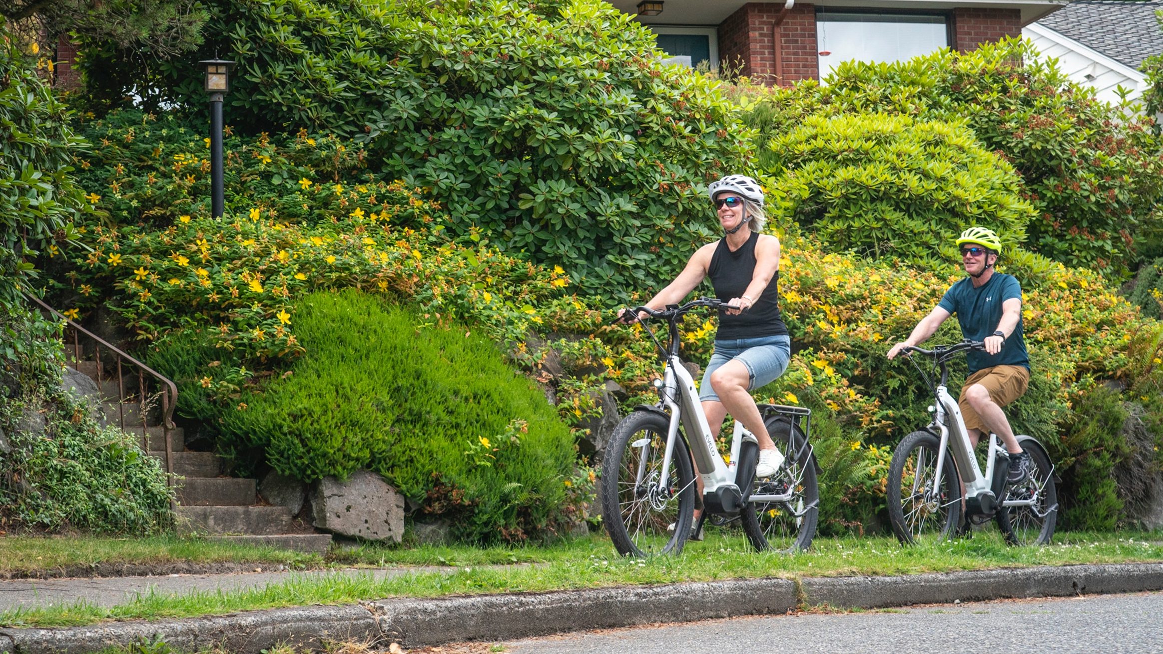 Two cyclists ride on a sidewalk in this undated photo. Los Angeles County has cleared the way to allow for cyclists to ride on sidewalks on roads maintained or operated by the County. (Photo by Team EVELO/Pels.com)