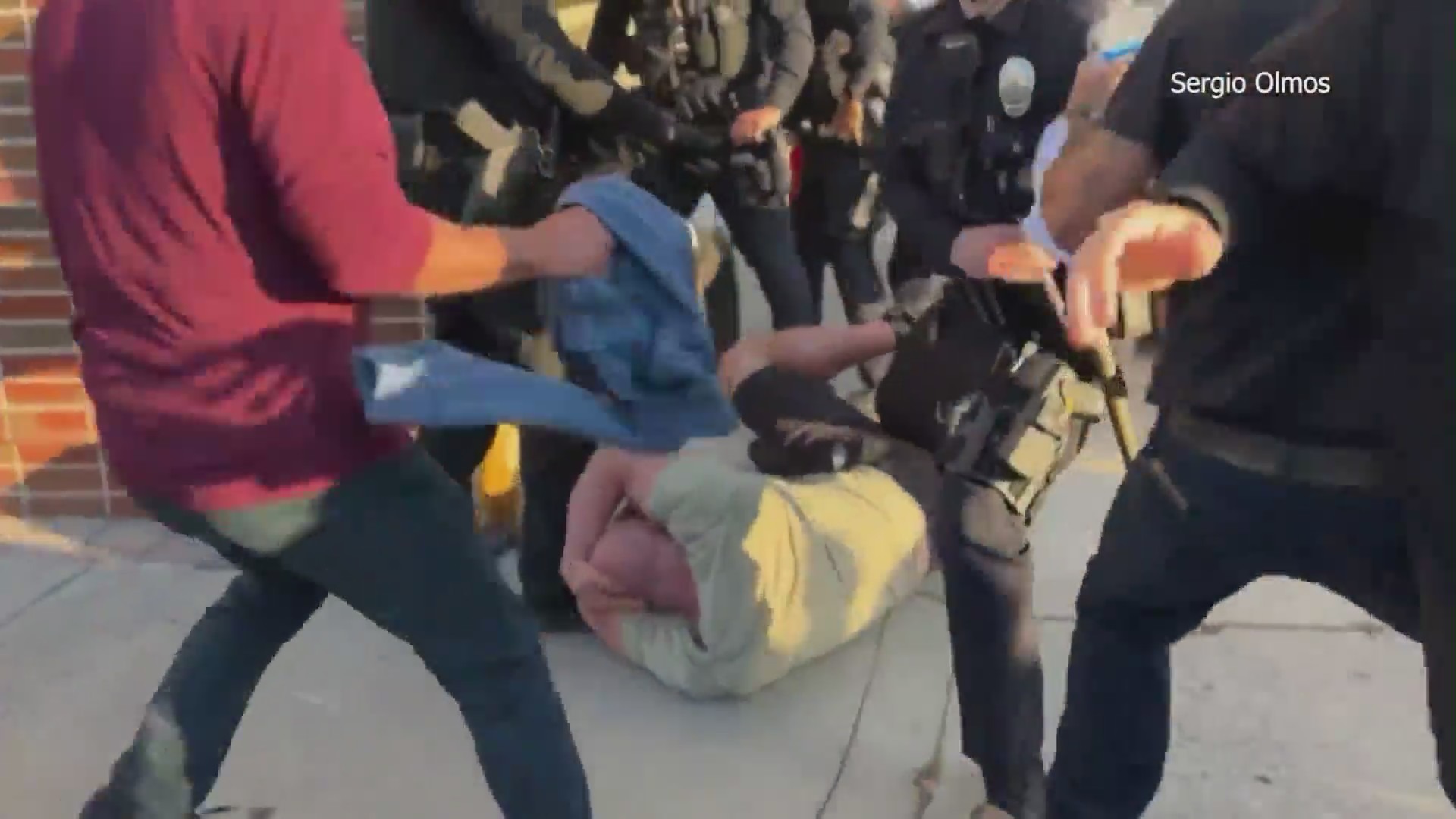 Fights broke out among demonstrators protesting Pride curriculum outside a Glendale school board meeting on June 20, 2023. (Sergio Olmos)