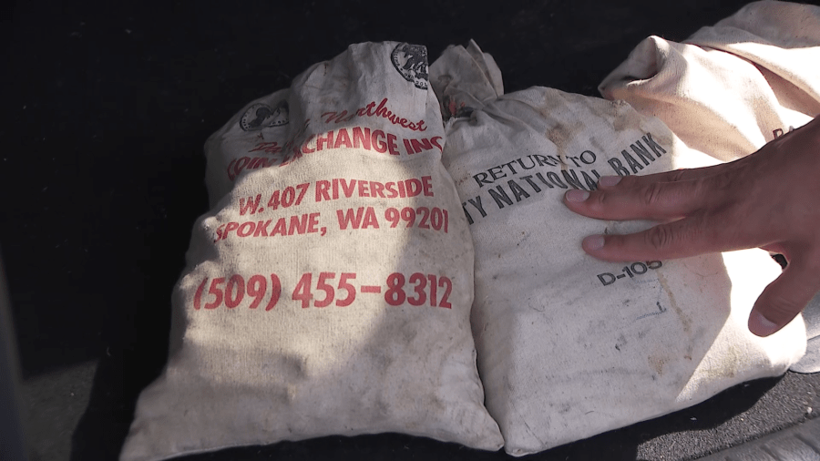 Several bags of copper pennies are seen in the car of John Reyes, who discovered 1 million pennies inside the home of his father-in-law in Los Angeles. Reyes said a sale has been made. (KTLA)