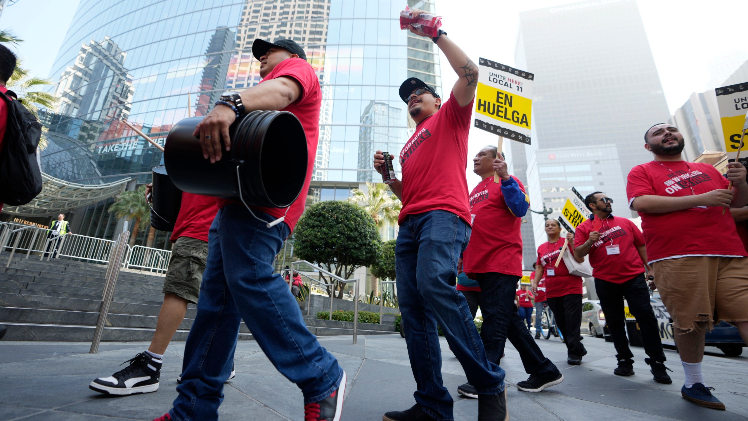 Striking hotel workers rally outside the Intercontinental Hotel after walking off their job early Sunday, July 2, 2023, in downtown Los Angeles. (AP Photo/Damian Dovarganes)