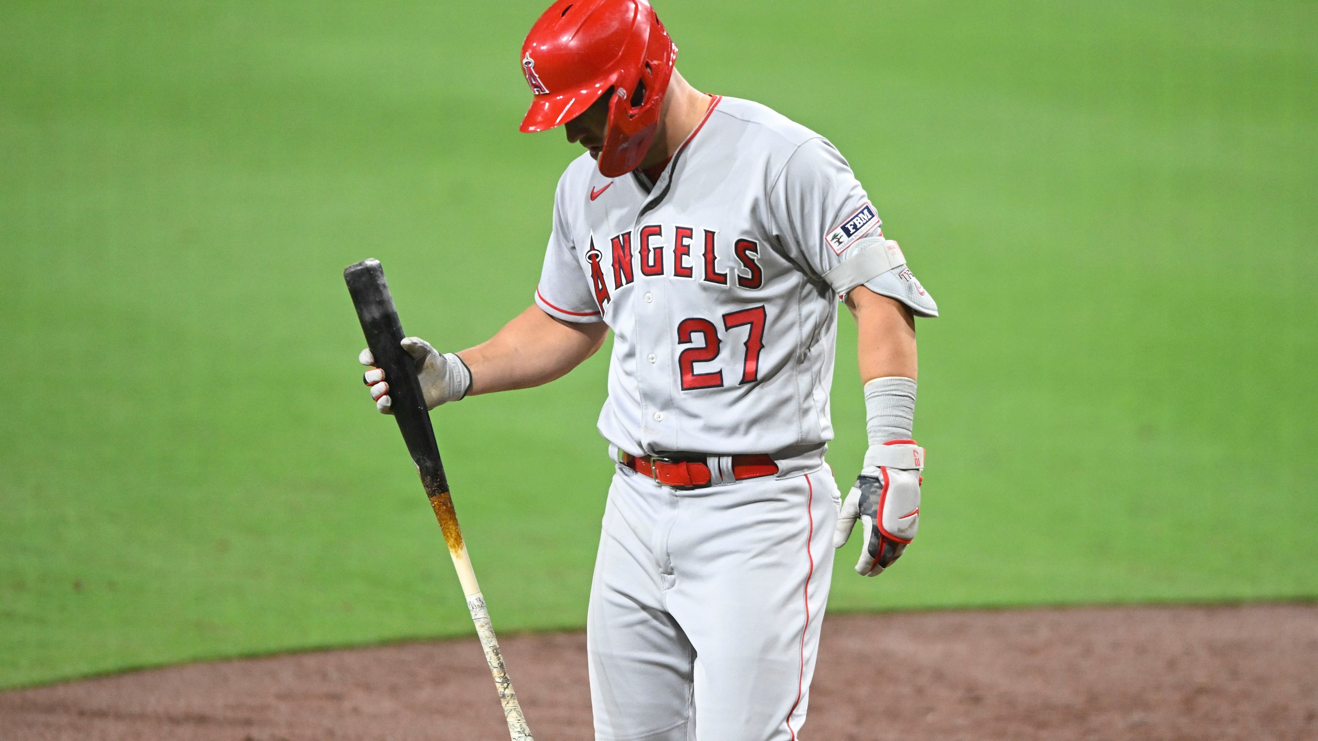 Los Angeles Angels' Mike Trout (27) leaves the game during the eighth inning of a baseball game against the San Diego Padres Monday, July 3, 2023, in San Diego. (AP Photo/Denis Poroy)